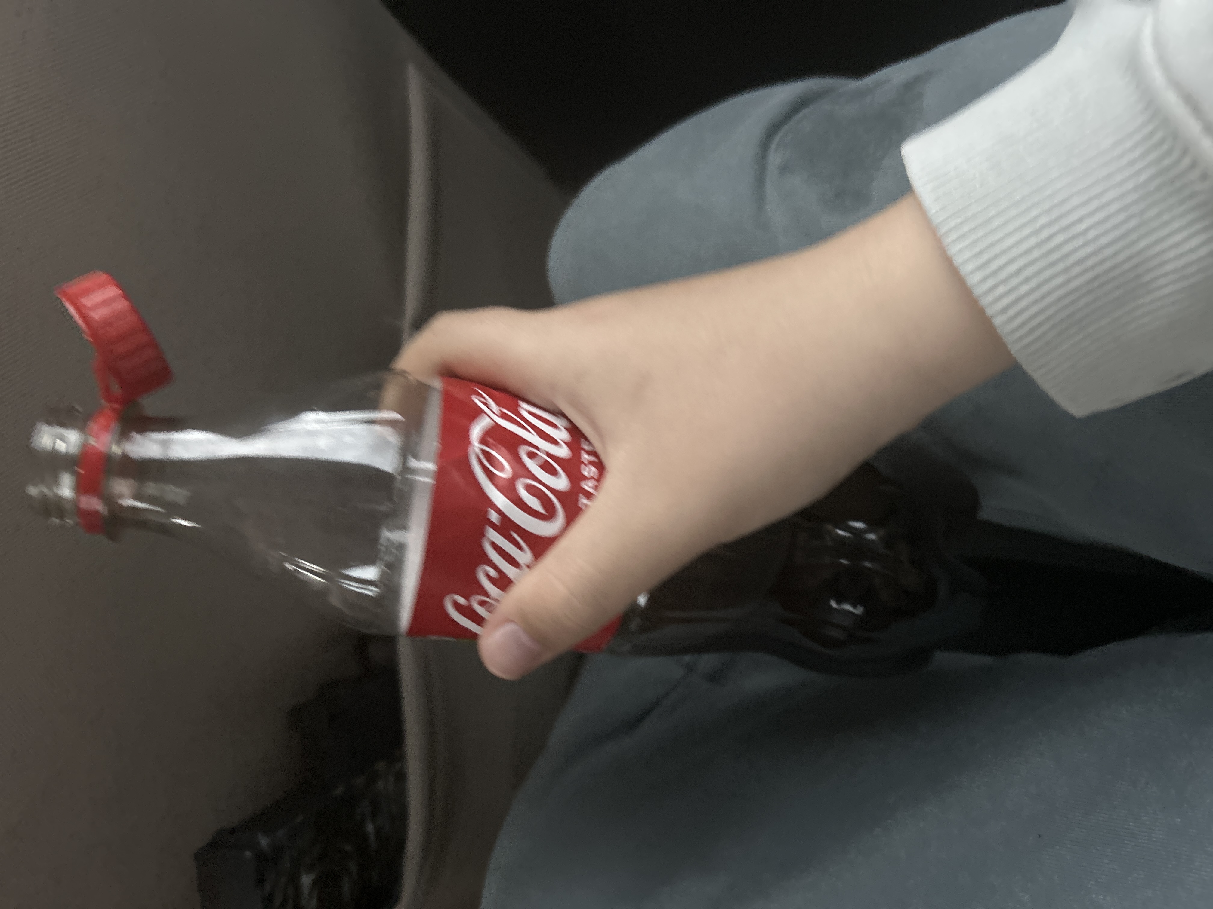 Drinking coke in a car for no reason 